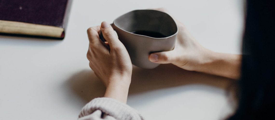 Girl holding cup in therapy